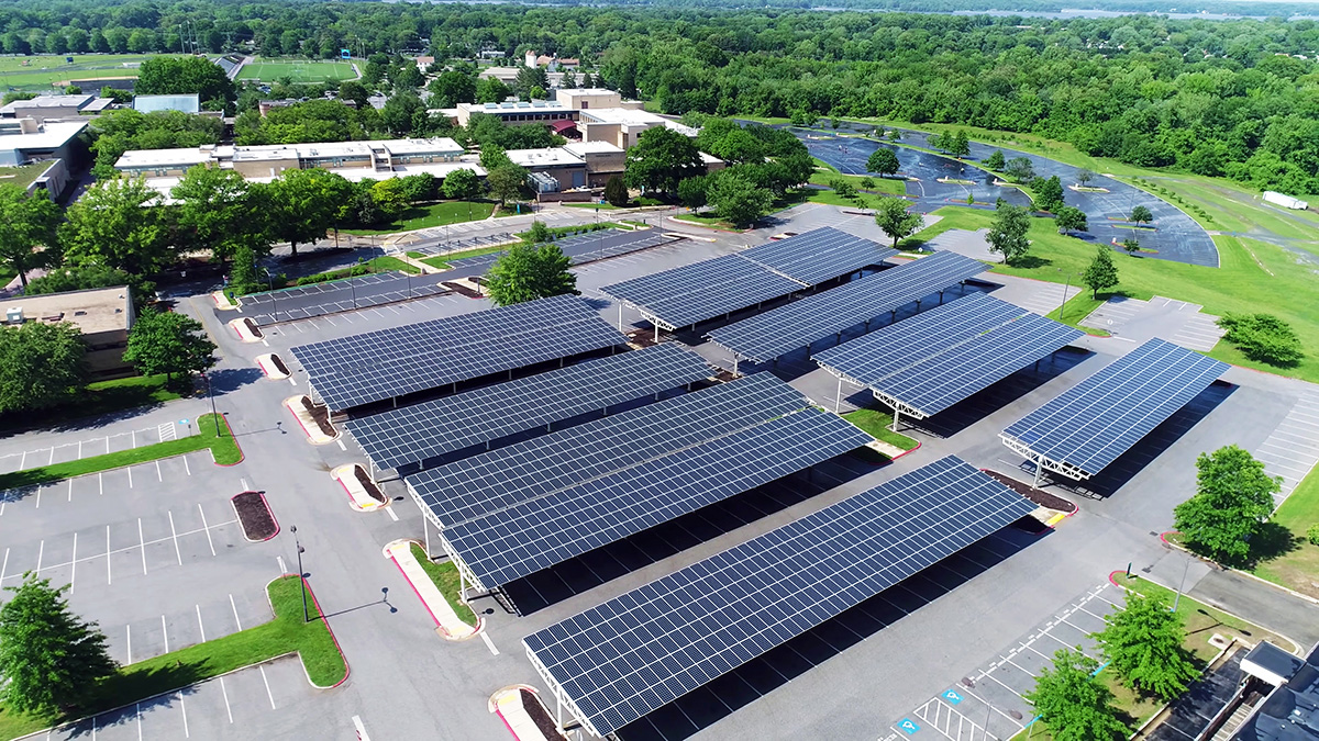 aerial-view-of-solar-panels-installed-in-roof-of-parking-1143727458_1200x675_ecosolar