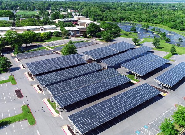 aerial-view-of-solar-panels-installed-in-roof-of-parking-1143727458_1200x675_ecosolar